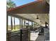 Relax on the outdoor patio with overhead fans, tables, and seating while enjoying ocean views at 7100 N Ocean Blvd. N # 1011, Myrtle Beach, SC 29572