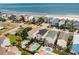 Aerial view of oceanfront neighborhood featuring well-maintained homes, private pools, and proximity to the beach at 712A Ocean Blvd. S, Surfside Beach, SC 29575