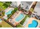 Beautiful aerial view showcasing multiple backyard pools and outdoor living spaces in a vibrant community at 712A Ocean Blvd. S, Surfside Beach, SC 29575