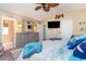 Beach themed bedroom featuring a king-sized bed, large dresser, and flat-screen TV at 712A Ocean Blvd. S, Surfside Beach, SC 29575