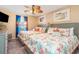 Bedroom offers a fan, two beds, and decorative seashell bedding at 712A Ocean Blvd. S, Surfside Beach, SC 29575