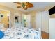 Comfortable bedroom featuring nautical decor, a ceiling fan, and ample closet space at 712A Ocean Blvd. S, Surfside Beach, SC 29575