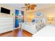 Cozy bedroom with beach-themed decor, a ceiling fan, and wood flooring at 712A Ocean Blvd. S, Surfside Beach, SC 29575