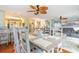 Dining area leading into the living room has decorative table setting and overhead lighting at 712A Ocean Blvd. S, Surfside Beach, SC 29575