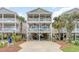 Charming three-story beach house with multiple decks and classic coastal architecture details at 712A Ocean Blvd. S, Surfside Beach, SC 29575