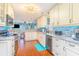 Bright kitchen featuring white cabinetry, granite countertops, and stainless steel appliances at 712A Ocean Blvd. S, Surfside Beach, SC 29575