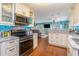 Open-concept kitchen with modern appliances and easy flow into the living and dining areas at 712A Ocean Blvd. S, Surfside Beach, SC 29575