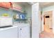 Laundry room has shelving and appliances at 712A Ocean Blvd. S, Surfside Beach, SC 29575