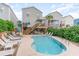 Backyard oasis featuring a refreshing pool, tiki bar, and comfortable seating for ultimate outdoor enjoyment at 712A Ocean Blvd. S, Surfside Beach, SC 29575