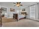 Bedroom with ceiling fan, neutral carpet, and natural light from the window at 7317 Lieth Ln., Sunset Beach, NC 28468