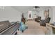 Bonus room featuring a piano, comfortable seating, and a television at 7317 Lieth Ln., Sunset Beach, NC 28468