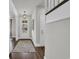 Inviting foyer with a stylish light fixture, wood floors, and view of the front yard at 7317 Lieth Ln., Sunset Beach, NC 28468