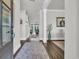 Elegant foyer featuring wood floors and views into the living spaces, illuminated by natural light at 7317 Lieth Ln., Sunset Beach, NC 28468
