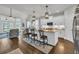 Gourmet kitchen with a large island, granite countertops, stainless appliances, and seating at 7317 Lieth Ln., Sunset Beach, NC 28468