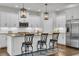 Well-appointed kitchen island with granite countertops, seating, and stainless steel appliances at 7317 Lieth Ln., Sunset Beach, NC 28468