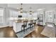 Stylish kitchen island featuring granite countertops, seating, and stainless steel appliances at 7317 Lieth Ln., Sunset Beach, NC 28468