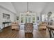 Bright living room with large windows overlooking the backyard and stylish furnishings at 7317 Lieth Ln., Sunset Beach, NC 28468