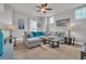 Spacious living room featuring a sectional couch, decorative pillows, and stylish artwork at 7317 Lieth Ln., Sunset Beach, NC 28468