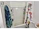 Bright bathroom with a shower-tub combo and stylish curtain and a tiled shower at 755 Burcale Rd. # G4, Myrtle Beach, SC 29579