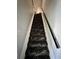 The carpeted stairway has a distinctive zebra pattern and a black handrail at 755 Burcale Rd. # G4, Myrtle Beach, SC 29579