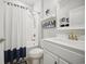 Clean bathroom featuring white fixtures, a shower with curtain, and contemporary decor at 779 Salerno Circle # A, Myrtle Beach, SC 29579