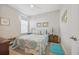 Cozy bedroom with a ceiling fan, a window with blinds, and light walls at 779 Salerno Circle # A, Myrtle Beach, SC 29579