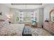 Bright bedroom with bay windows, seating, and a neutral color palette at 779 Salerno Circle # A, Myrtle Beach, SC 29579