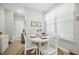 Cozy dining area with a white round table, chairs, and a window with natural light at 779 Salerno Circle # A, Myrtle Beach, SC 29579