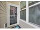 Front door with sidelight window and welcome mat at 779 Salerno Circle # A, Myrtle Beach, SC 29579
