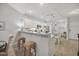Well-lit kitchen with white cabinets, granite countertops, stainless steel appliances, and a breakfast bar at 779 Salerno Circle # A, Myrtle Beach, SC 29579