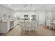 Bright, all-white kitchen with stainless steel appliances, granite countertops, and modern pendant lighting at 779 Salerno Circle # A, Myrtle Beach, SC 29579
