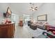 Inviting living room with vaulted ceiling, ceiling fan, sliding glass doors and comfortable furnishings at 779 Salerno Circle # A, Myrtle Beach, SC 29579
