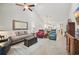 Spacious living room with a vaulted ceiling, neutral tones, comfortable seating, and wood-look flooring at 779 Salerno Circle # A, Myrtle Beach, SC 29579