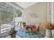 Charming sunroom with wicker furniture and a serene outdoor view at 779 Salerno Circle # A, Myrtle Beach, SC 29579