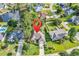Aerial view of a beautiful home in a neighborhood near a winding creek and well-manicured lawns at 86 Black River Rd., Myrtle Beach, SC 29588