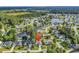 Expansive aerial view showcasing the house and surrounding community with a scenic lake and lush greenery at 86 Black River Rd., Myrtle Beach, SC 29588