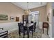 Formal dining room with elegant chandelier, wainscoting, and decorative rug create inviting atmosphere at 86 Black River Rd., Myrtle Beach, SC 29588