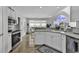Well-lit kitchen with white cabinets, stainless steel appliances, and an eat-in breakfast area at 86 Black River Rd., Myrtle Beach, SC 29588