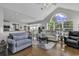 Bright living room with large window, hardwood floors, and comfortable seating area at 86 Black River Rd., Myrtle Beach, SC 29588
