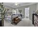 Spacious main bedroom includes ceiling fan, dresser, and ensuite bathroom access at 86 Black River Rd., Myrtle Beach, SC 29588