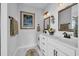 Elegant bathroom with double sink vanity, framed mirror, and modern fixtures at 915 Palmetto St., Georgetown, SC 29440