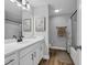 Bright bathroom featuring a double vanity, framed art and wood look flooring at 915 Palmetto St., Georgetown, SC 29440