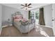 Well-lit bedroom featuring an ornate bed frame, patterned bedding, and side table at 915 Palmetto St., Georgetown, SC 29440
