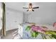 Comfortable bedroom featuring a ceiling fan and a bed with colorful floral bedding at 915 Palmetto St., Georgetown, SC 29440
