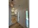 Bright foyer with wood floors and a stylish overhead star light at 915 Palmetto St., Georgetown, SC 29440