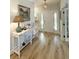 Elegant foyer with wood floors, stylish table decor, and an eye-catching star-shaped pendant light at 915 Palmetto St., Georgetown, SC 29440