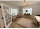 Bright office with natural light, wood floors, neutral walls, decorative rug, and a woven light fixture at 915 Palmetto St., Georgetown, SC 29440