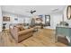 Bright, airy living room features a large sectional, wood floors, and stylish decor, perfect for entertaining at 915 Palmetto St., Georgetown, SC 29440