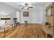 Open living room with laminate flooring, ceiling fan, and ample space for furnishings at 915 Palmetto St., Georgetown, SC 29440
