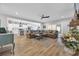 Spacious living room open to kitchen, features stylish seating, wood floors, and natural light at 915 Palmetto St., Georgetown, SC 29440